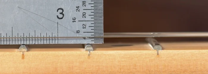 measure string action with a ruler